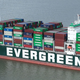 A close up photo of the Evergreen logo on the side of the stuck ship.